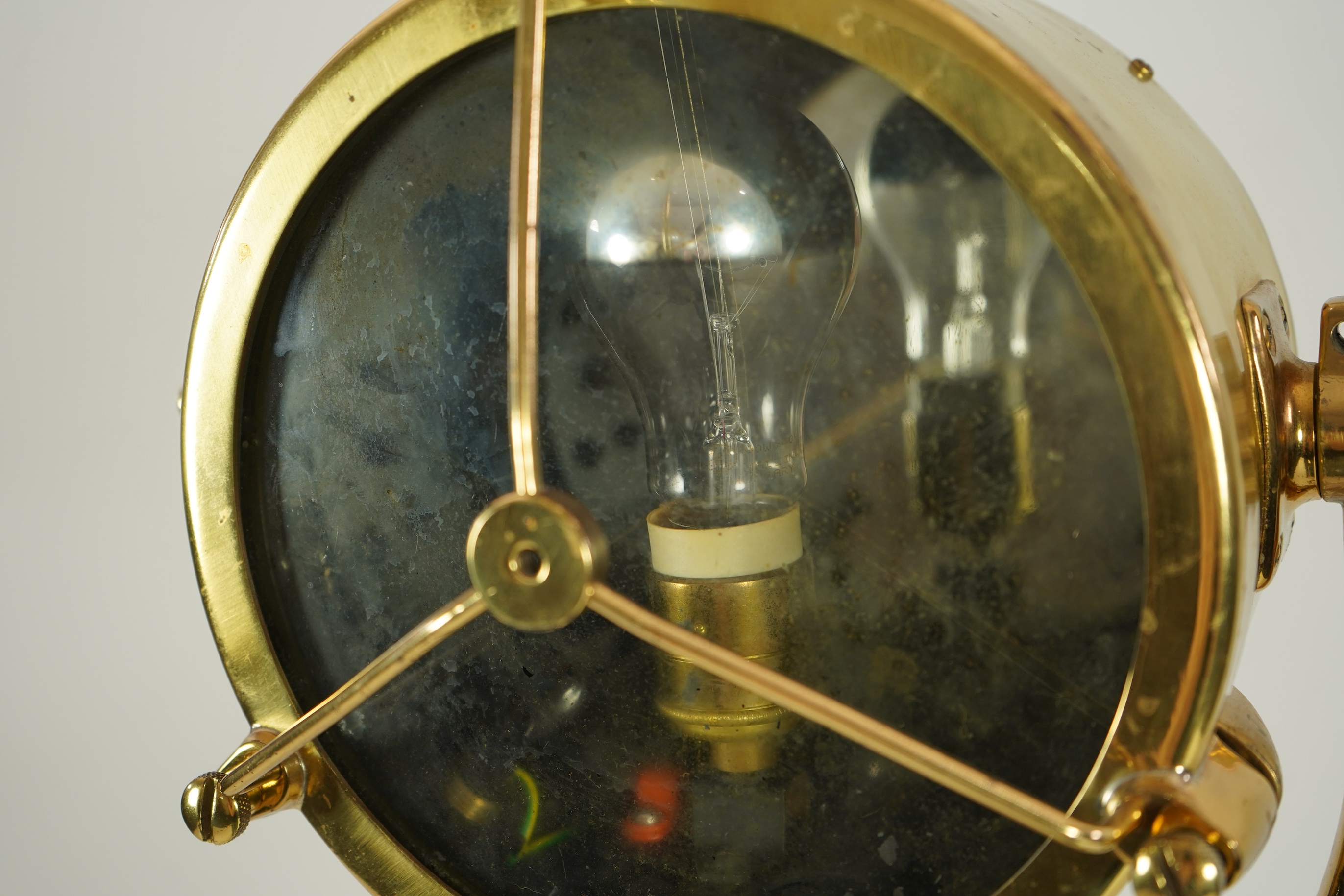 A mid 20th century polished brass marine searchlight